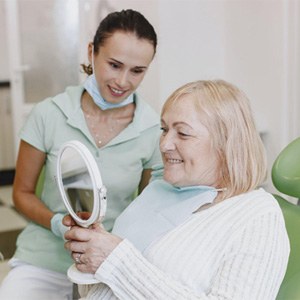 Older woman in dental chair for dentures
