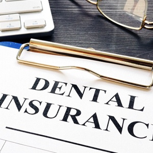 Dental insurance claim form and pen